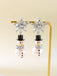 Boucles d'oreilles bonhomme de neige en strass flocons de neige et perles