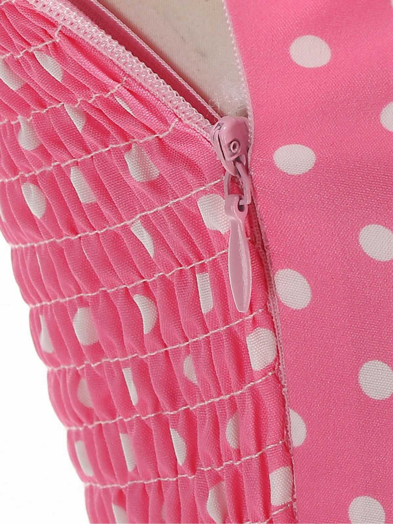 Robe swing ceinturée col halter à pois années 50