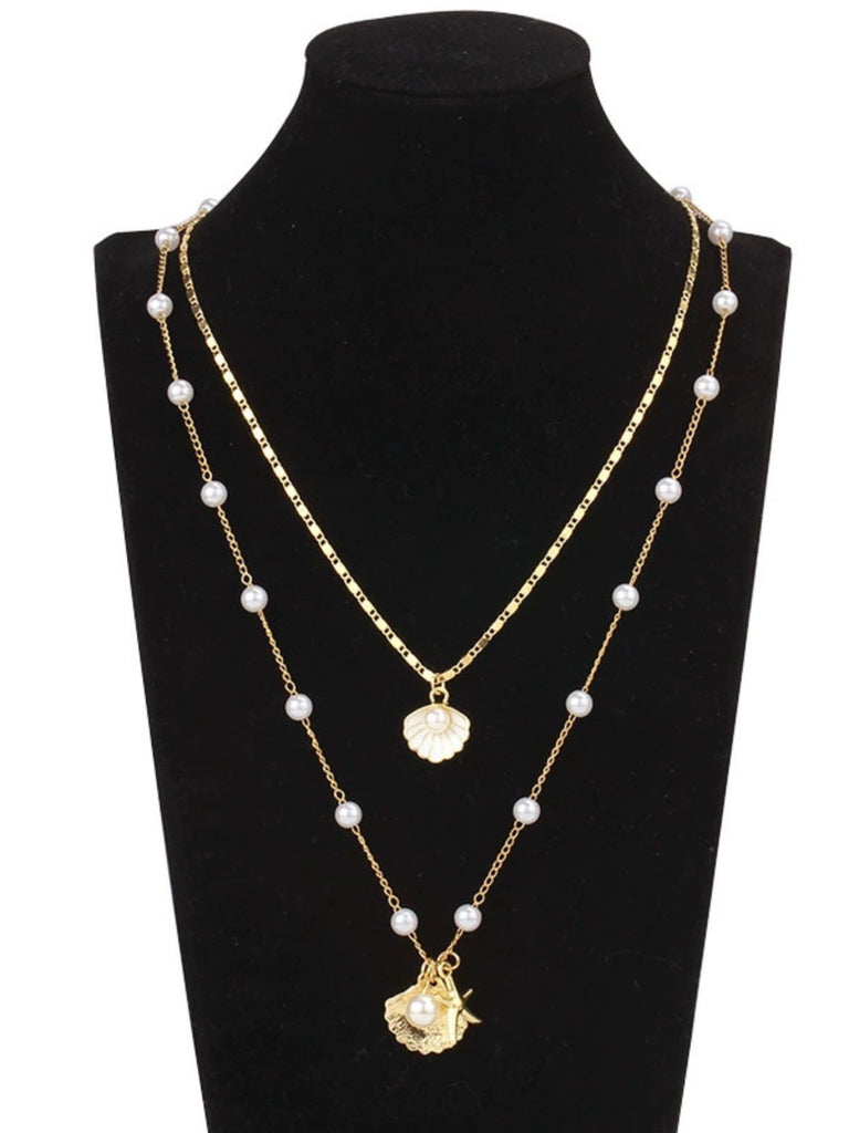 Collier superposé en coquillages perles et étoiles de mer