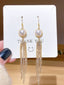Boucles d'oreilles à pampilles en perles dorées vintage