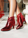 Bottines Chelsea à bout pointu et pompons métalliques
