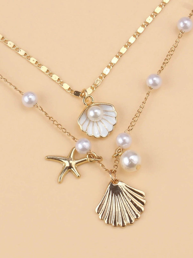 Collier superposé en coquillages perles et étoiles de mer