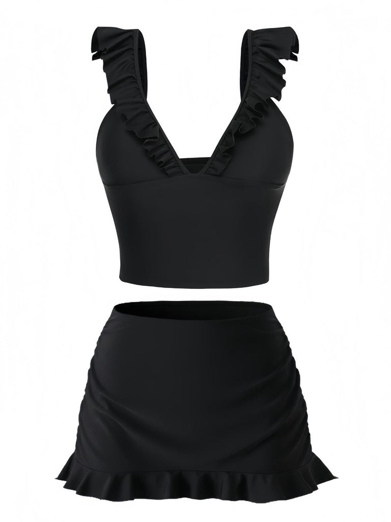 Black two-piece swimsuit with ruffled details on a white background