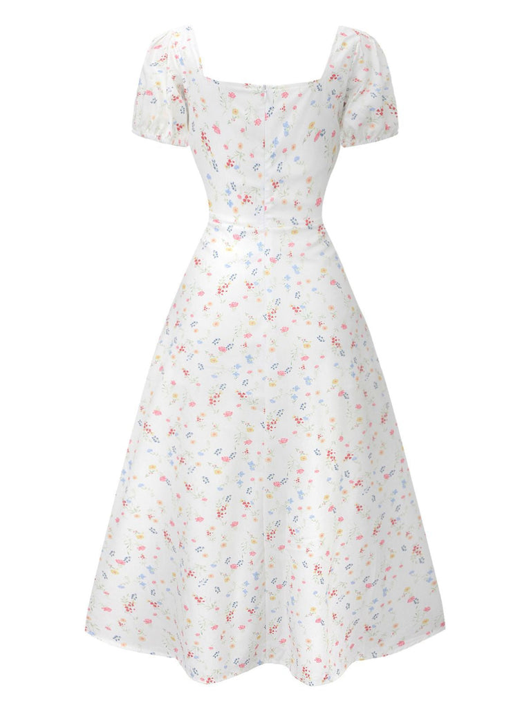 Robe blanche à fleurs col carré et manches bouffantes années 1930
