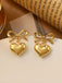Boucles d'oreilles pendantes en alliage avec nœud en forme de cœur