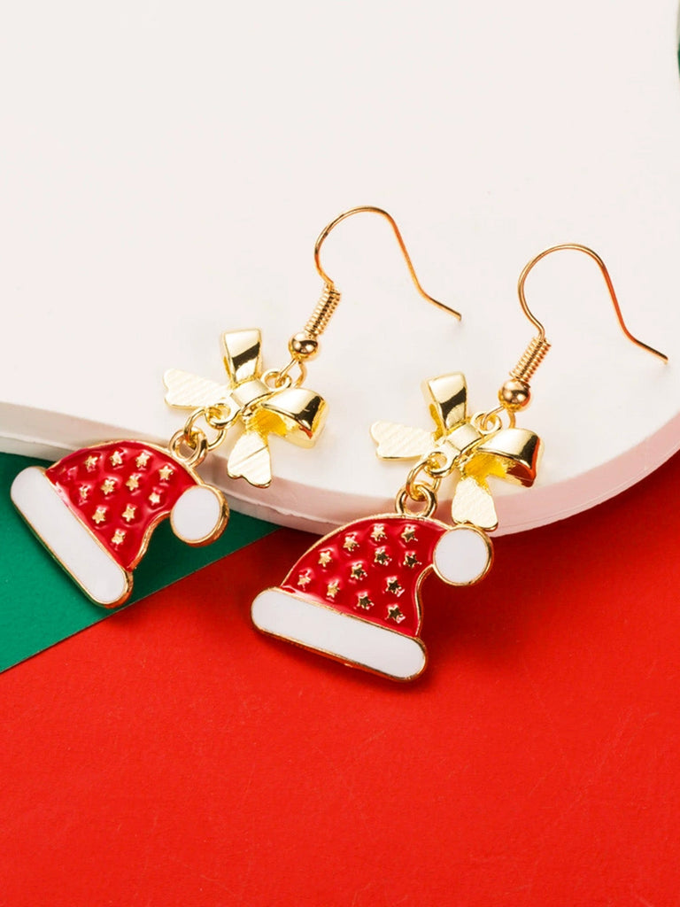 Boucles d'oreilles en strass et chapeau de Noël et un flocon de neige