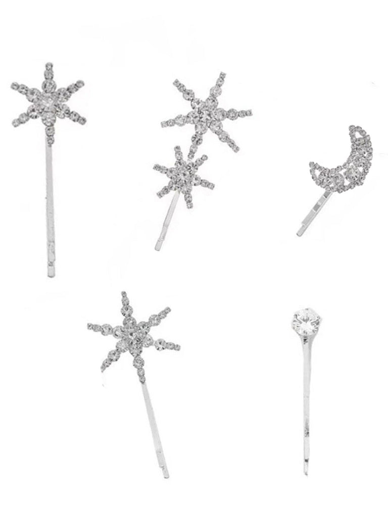 Set of silver hairpins with star and moon designs on a white background
