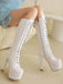 Bottes à talons aiguilles en cuir verni