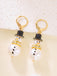 Boucles d'oreilles bonhomme de neige en strass flocons de neige et perles
