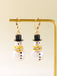 Boucles d'oreilles bonhomme de neige en strass flocons de neige et perles