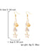 Gold earrings with starfish and shell designs, shown with measurements and weight on a white background.
