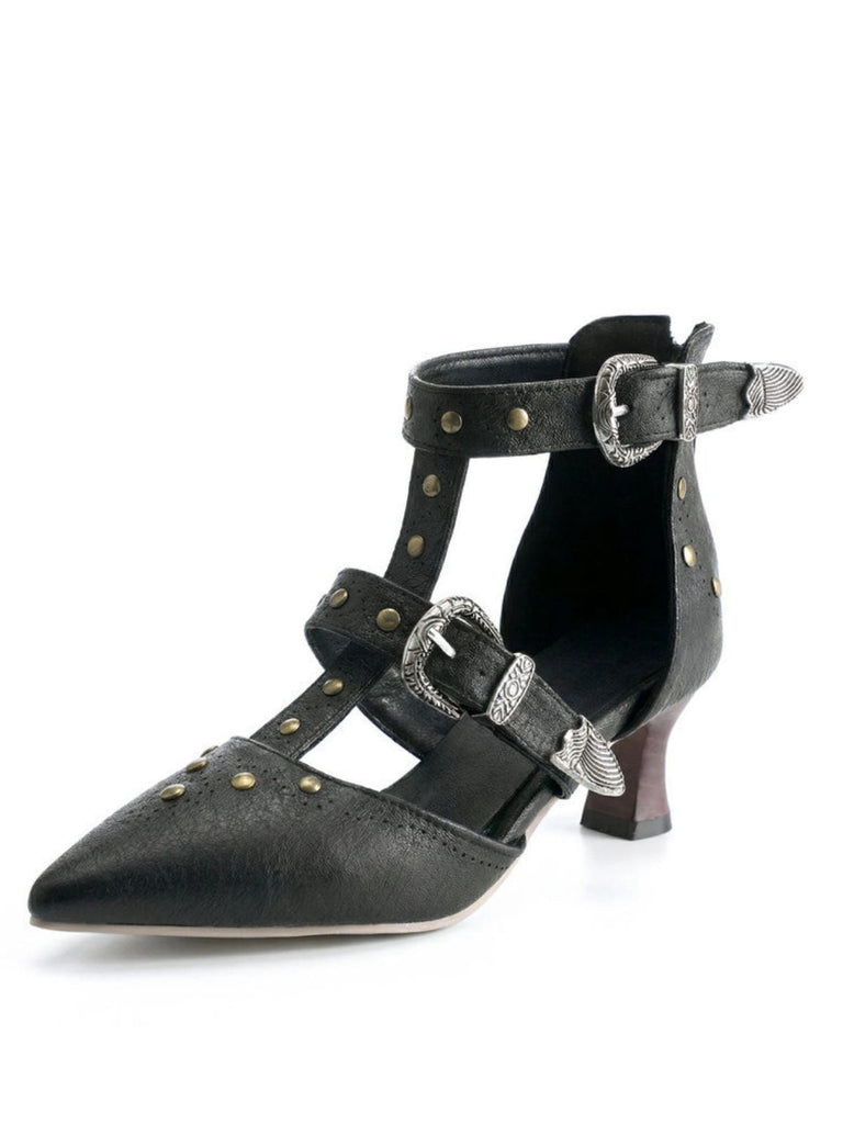 Black high-heeled shoes with silver buckles and studs on a white background