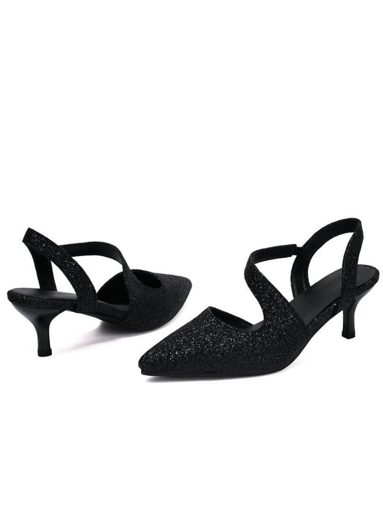 Black glittery high-heeled shoes on a white background