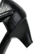 Close-up of a black leather shoe with a thick sole on a white background