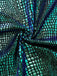 Close-up of a textured fabric with a pattern resembling scales in blue and green.