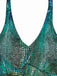 Teal and black patterned top on a white background