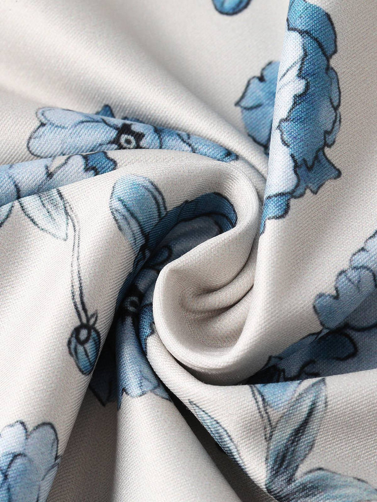 Close-up of fabric with blue floral pattern on a beige background
