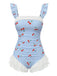 Maillot de bain une pièce bleu vintage à carreaux cerises et superposition de tulle à volants romantique, parfait pour un look de plage inspiré des pin-up des années 50
