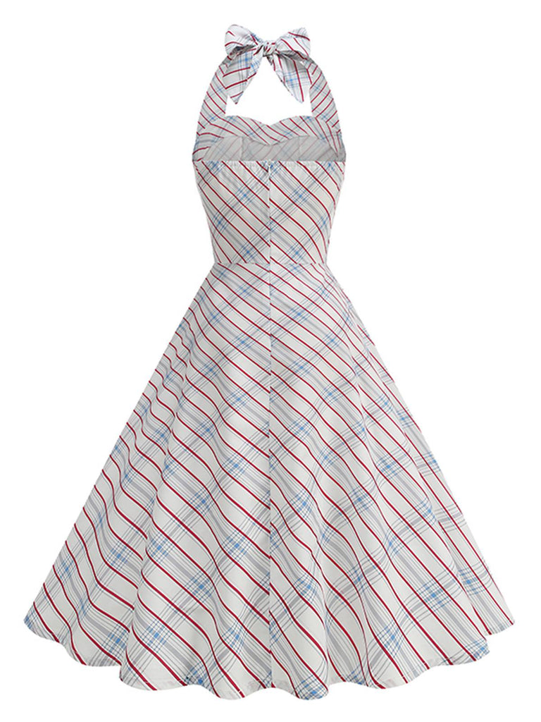 Striped halter neck dress with a bow detail on a white background