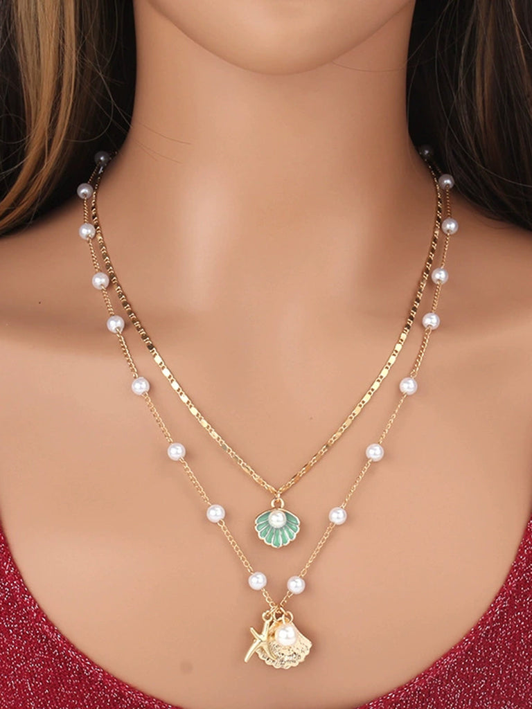 Collier superposé en coquillages perles et étoiles de mer