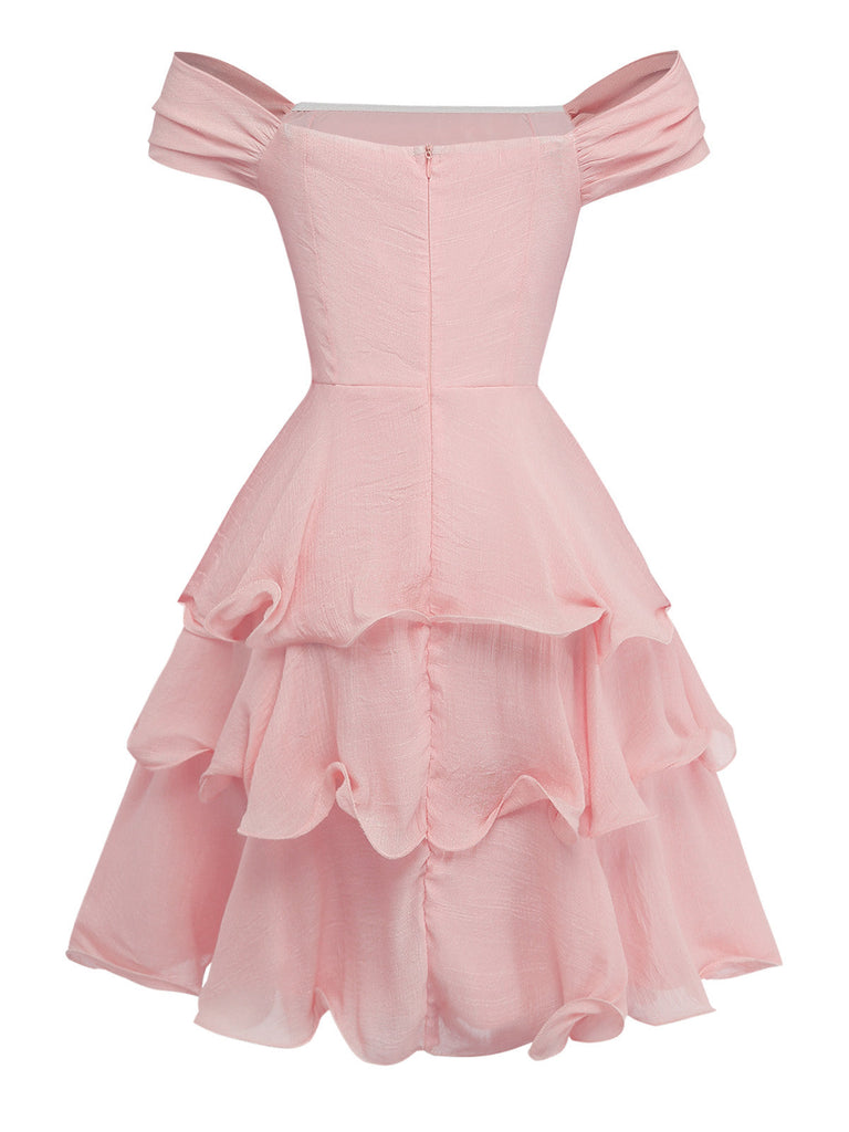 Pink off-shoulder dress with ruffled layers on a white background