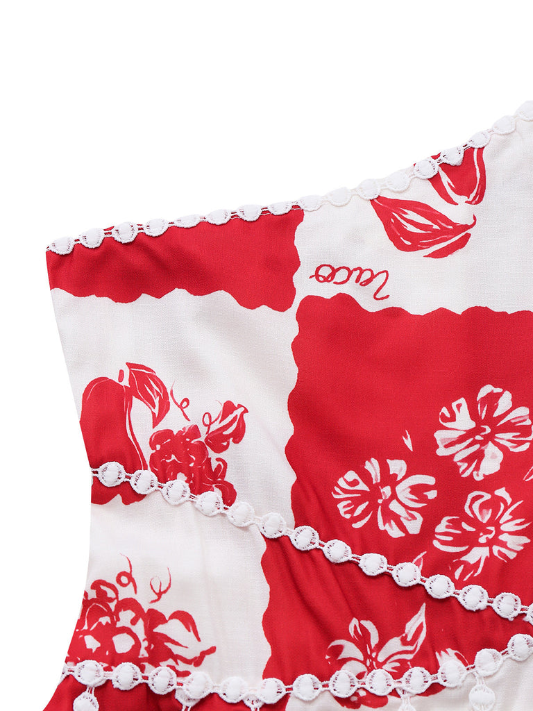Red and white floral patterned fabric with decorative trim on a white background