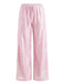 Pantalon à paillettes roses sur fond blanc