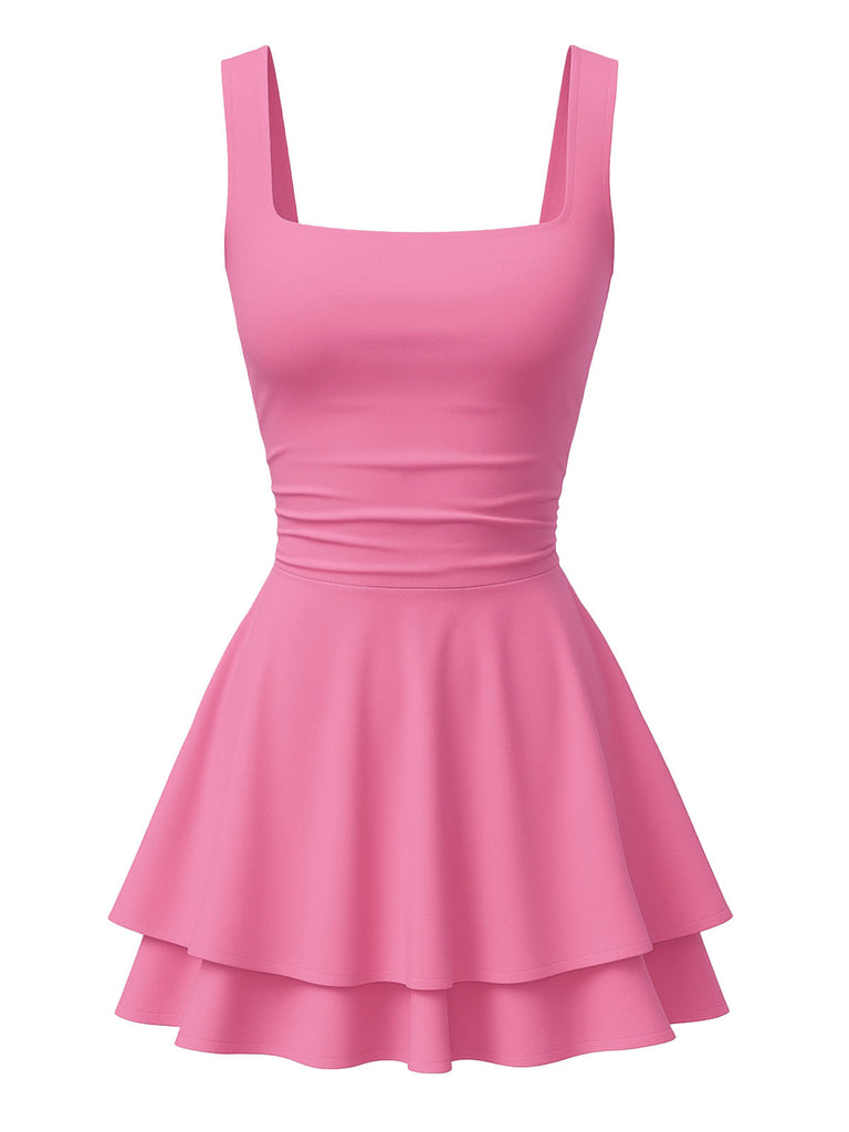 Vue de face en studio de la mini-robe à encolure carrée et à volants, d'un rose bonbon doux.