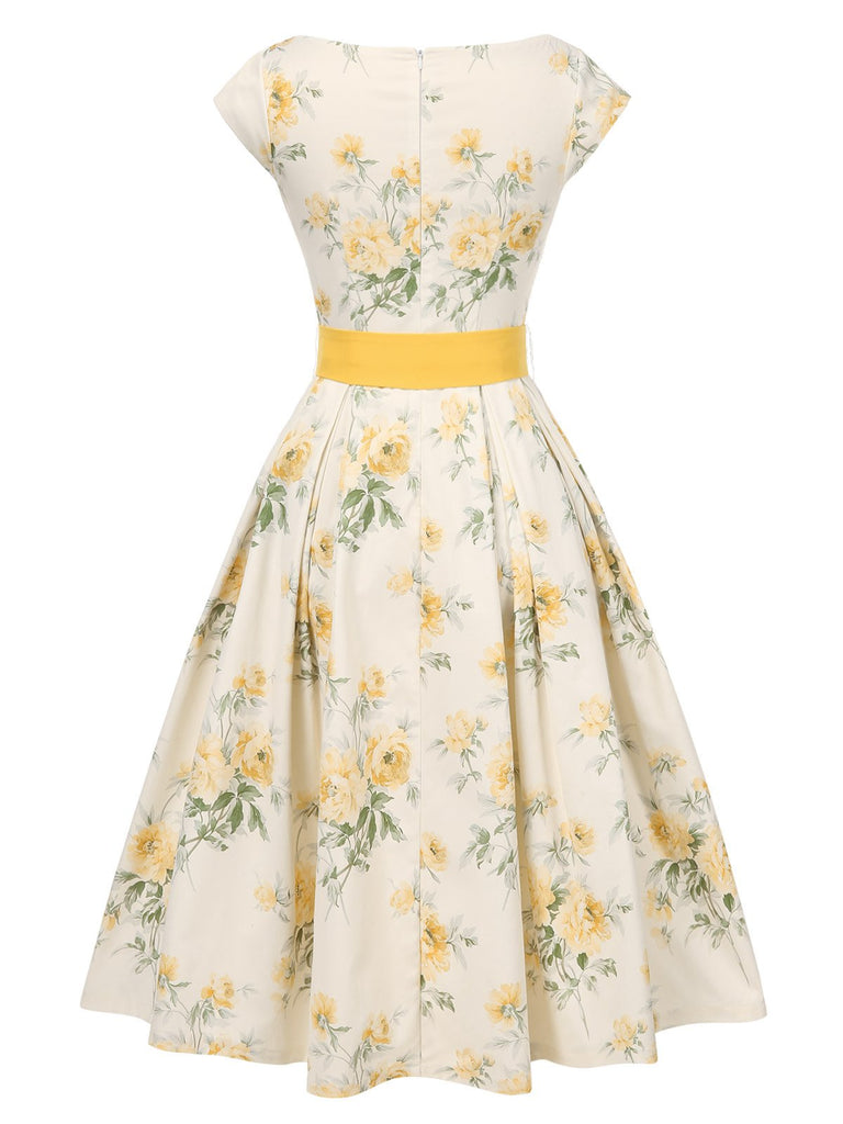 Robe jaune à fleurs antique col bateau ceinturée années 1950