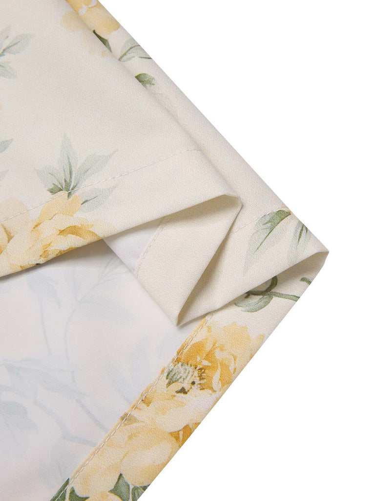 Robe jaune à fleurs antique col bateau ceinturée années 1950