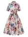 Robe  revers ceinturée à fleurs abricot des années 1940