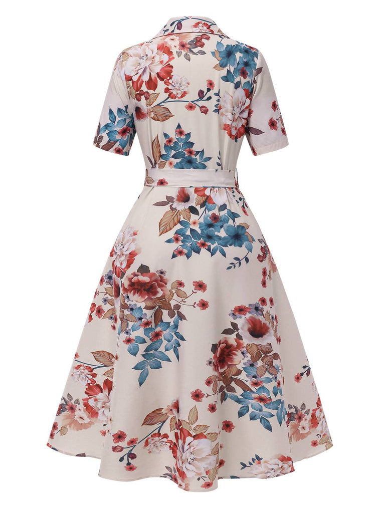 Robe  revers ceinturée à fleurs abricot des années 1940