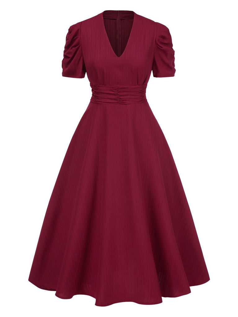 Robe manches bouffantes à col en V unie années 1950