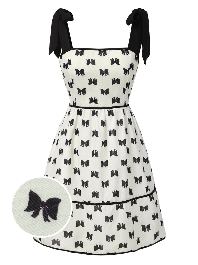 Robe smockée crème à bretelles et nœud papillon des années 1950