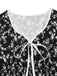 Robe noire à fleurs manches bouffantes à col en V années 1940