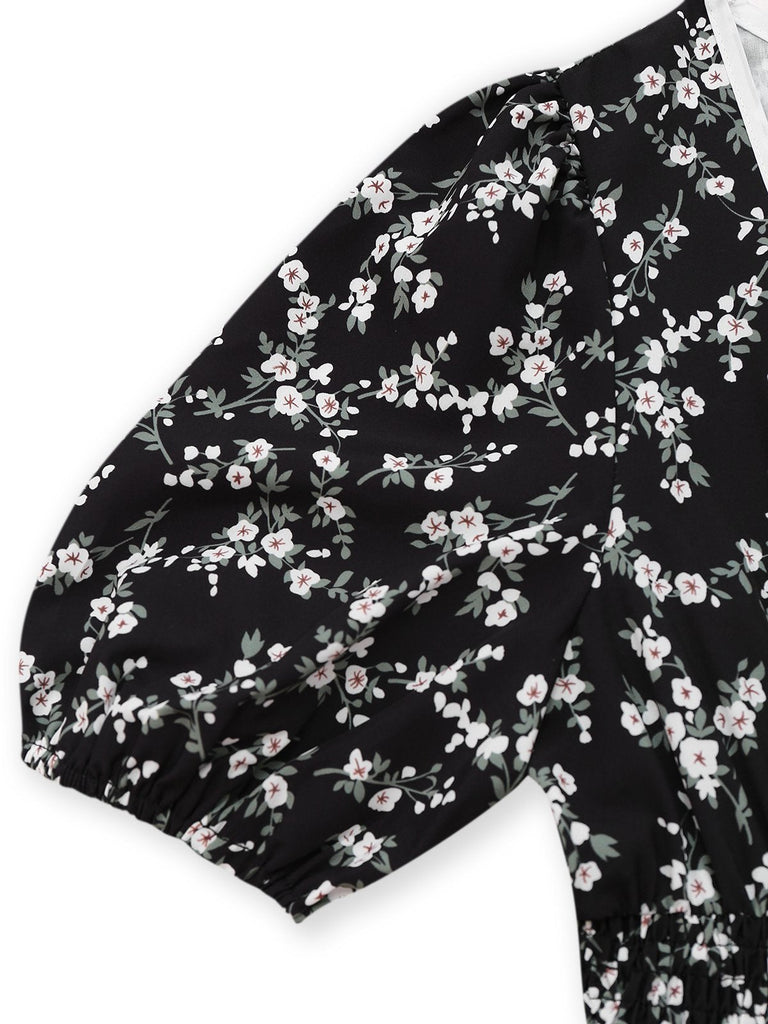 Robe noire à fleurs manches bouffantes à col en V années 1940