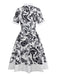 Robe chemise noire blanc à fleurs et ceinture des années 1940