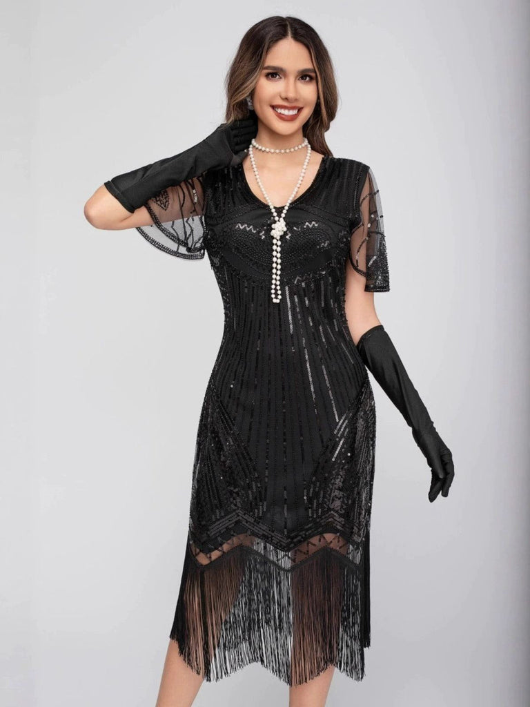 Robe Charleston à paillettes et pompons col rond années 1920