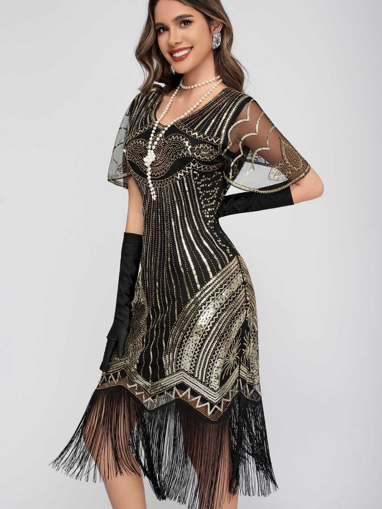 Robe Charleston à paillettes et pompons col rond années 1920