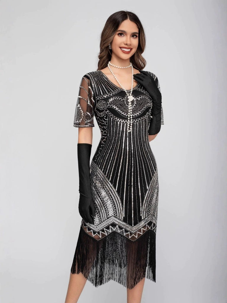 Robe Charleston à paillettes et pompons col rond années 1920