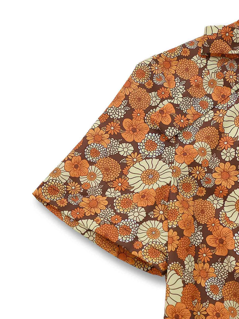 Combinaison orange col noué en velours côtelé motif marguerites années 1970