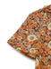 Combinaison orange col noué en velours côtelé motif marguerites années 1970