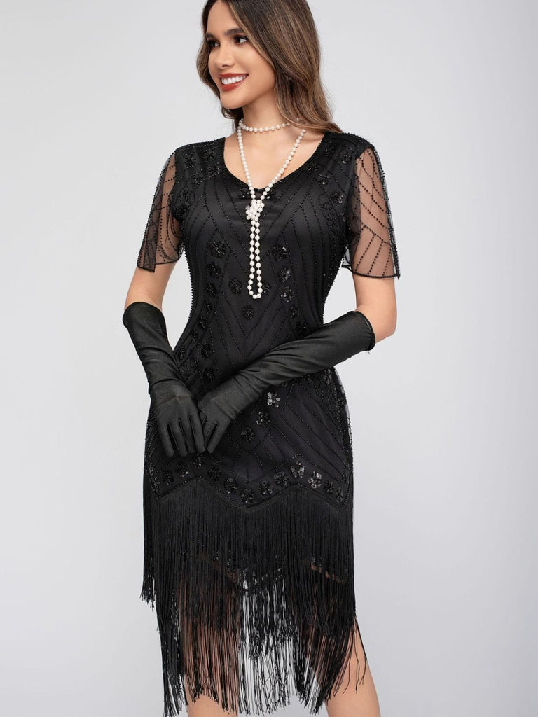 Robe de charleston manches courtes paillettes et franges des années 1920