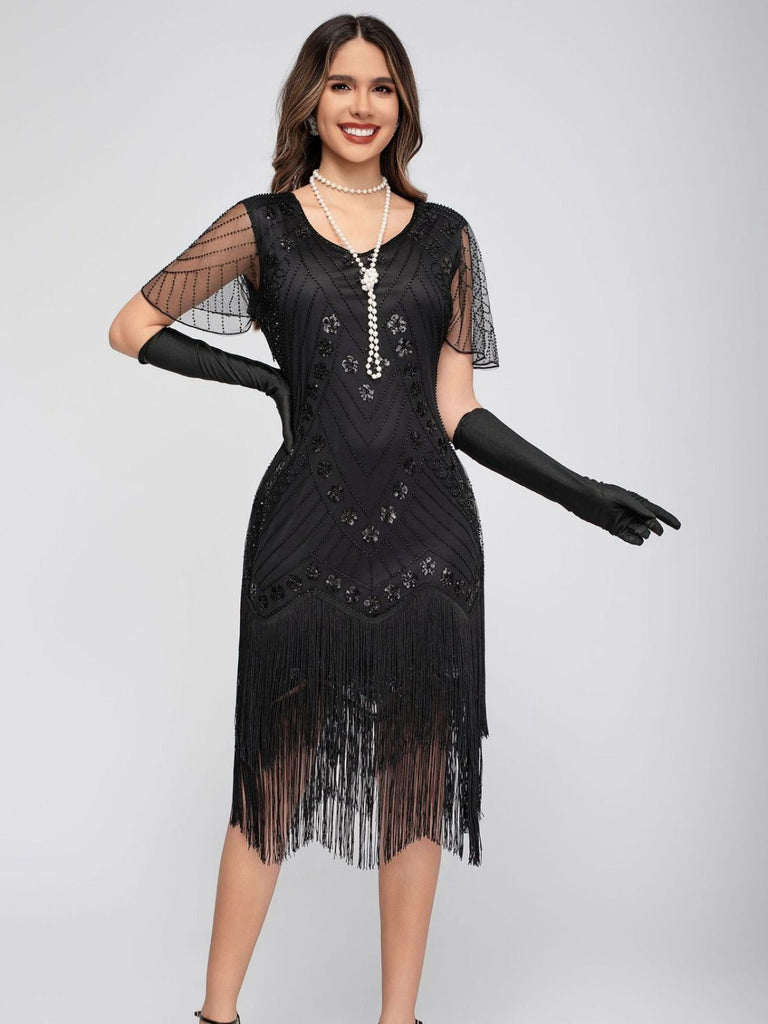 Robe de charleston manches courtes paillettes et franges des années 1920
