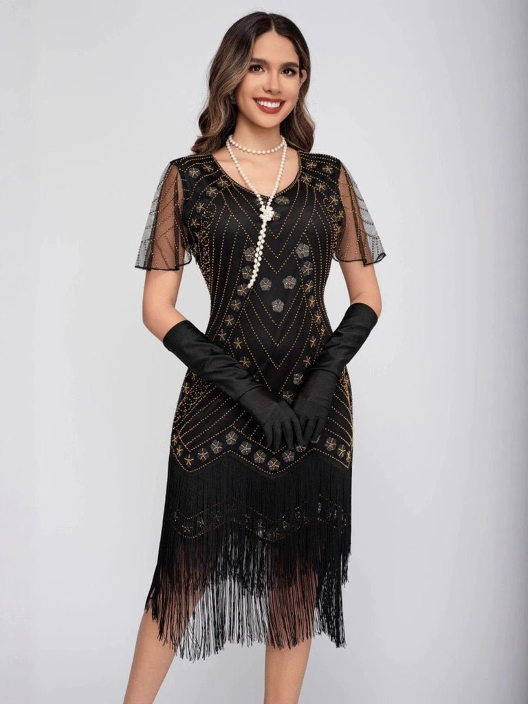 Robe de charleston manches courtes paillettes et franges des années 1920