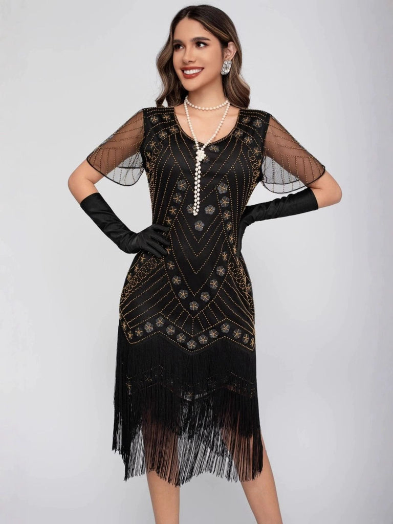 Robe de charleston manches courtes paillettes et franges des années 1920