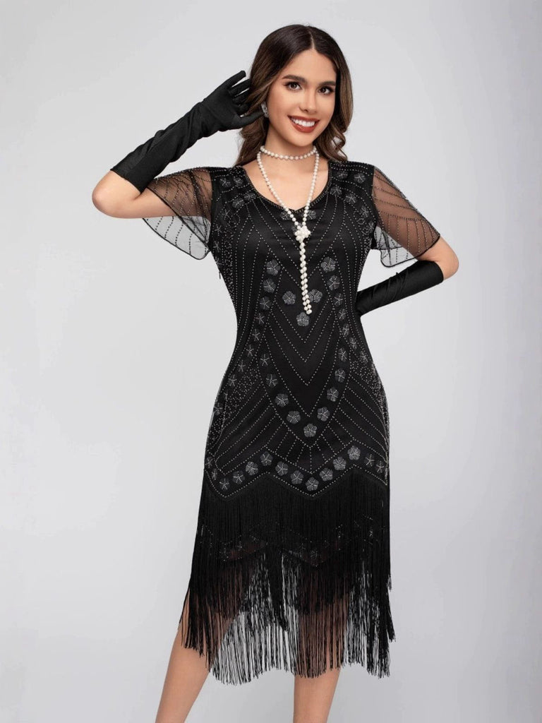 Robe de charleston manches courtes paillettes et franges des années 1920
