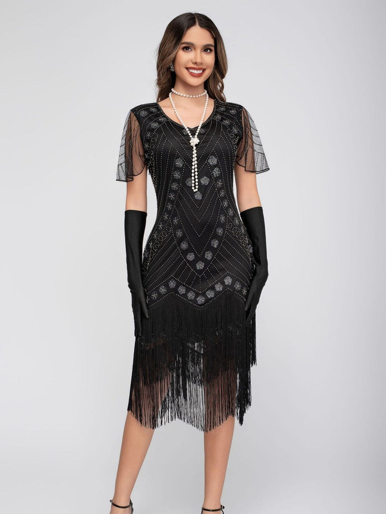 Robe de charleston manches courtes paillettes et franges des années 1920