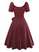 Robe rouge à carreaux col cœur froncée et nœud des années 50