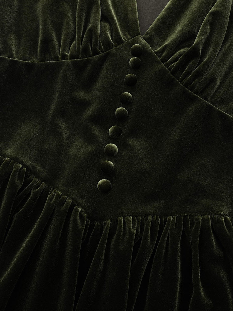 Robe verte en velours manches bouffantes col en V profond et froncées des années 1940